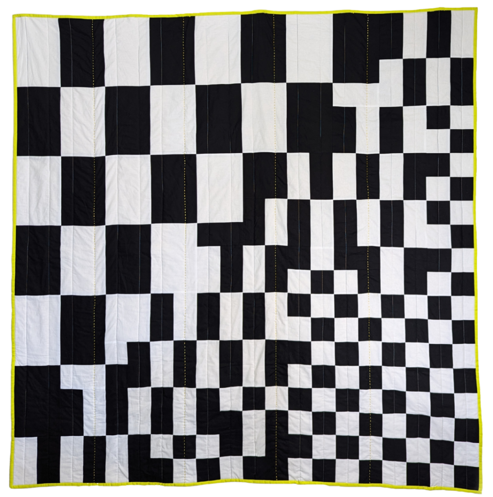 black and white checkerboard quilt with yellow border