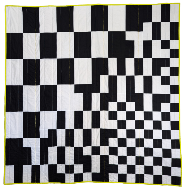 black and white checkerboard quilt with yellow border