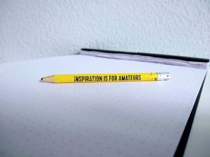 a yellow pencil with a Chuck Close quote 'inspiration is for amateurs''